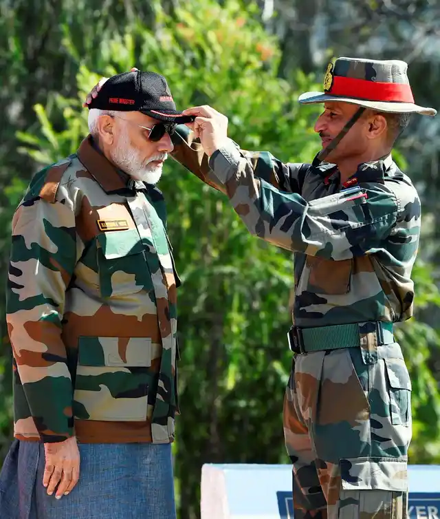 A jawan presented a cap to Prime Minister Narendra Modi during celebrating the Diwali with the jawans of the Indian Army, in J&K’s Rajouri.