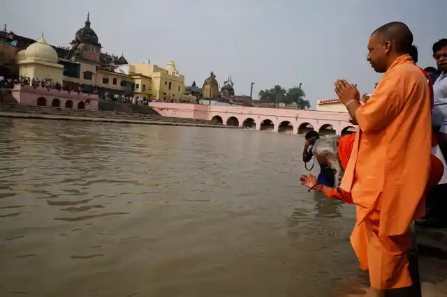 Uttar Pradesh Chief Minister Yogi Adityanath offers morning prayers on the banks of the River Sarayu as part of Diwali celebrations in Ayodhya.