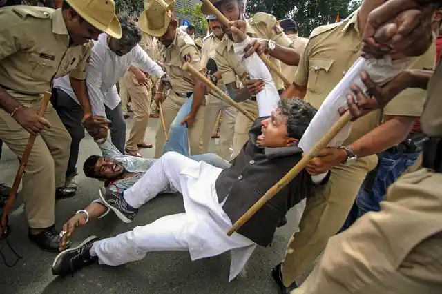 Police detain Congress workers who were staging a protest against BJPs Central and State governments over delay in the sanction of funds for North Karnataka, in Bengaluru, Wednesday, 23 Oct 2019.