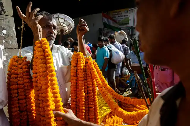 A vendor sells marigold flower garlands in Kolkata. 