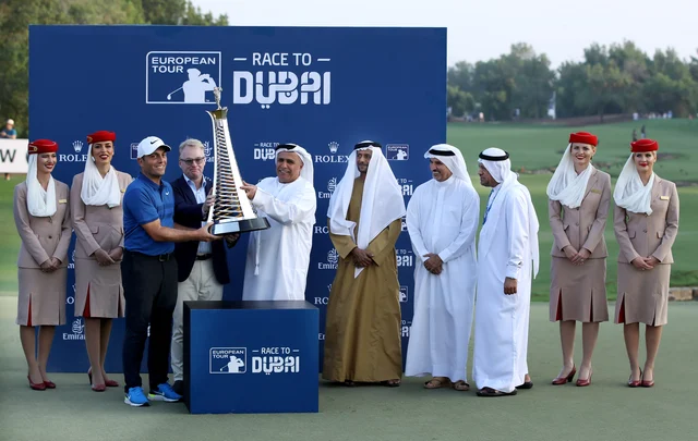 Francesco Molinari is handed his trophy