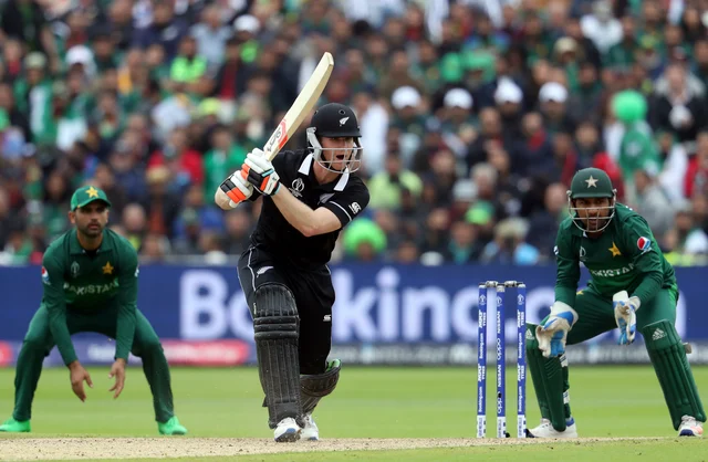 Neesham Plays a shot.
