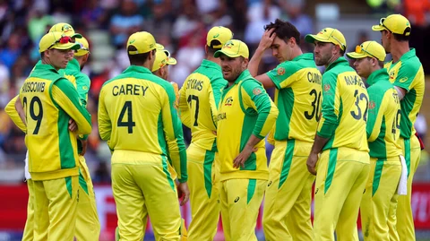 Australia's captain Aaron Finch, middle, with teammates