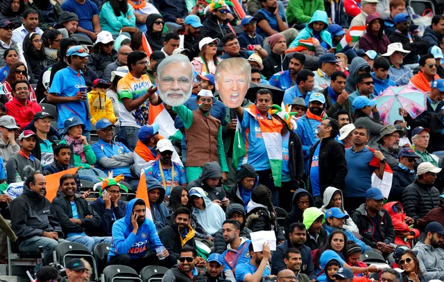 Indian supporters display portraits of U.S. President Donald Trump and Indian Prime Minister Narendra Modi during the Cricket World Cup semi-final match between India and New Zealand at Old Trafford in Manchester.