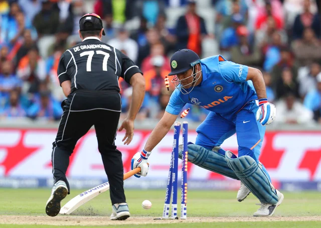 India's Mahendra Singh Dhoni is run out during the Cricket World Cup semifinal match between India and New Zealand at Old Trafford in Manchester.
