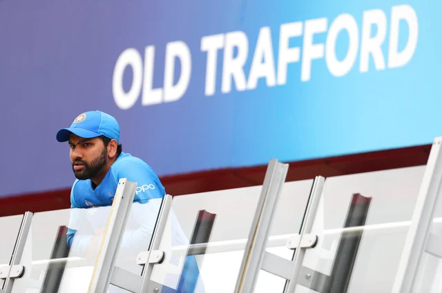 India's Rohit Sharma stands outside team's dressing room as he watches the Cricket World Cup semi-final match