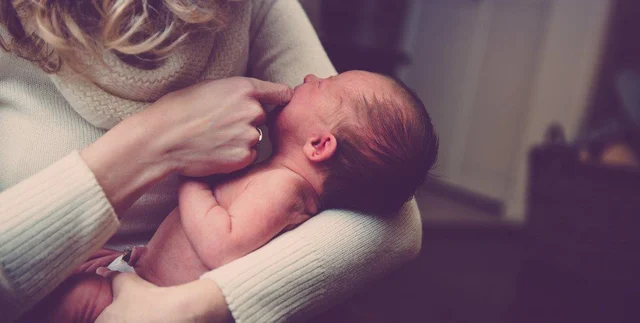 newborn baby with mother