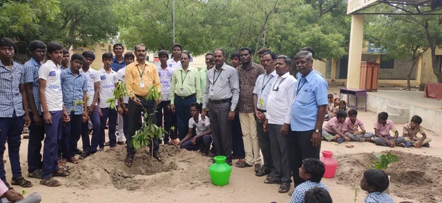 Munusamy with Saplings