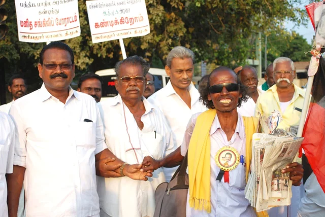 Mani with DMK workers