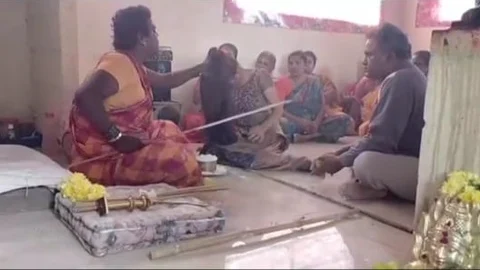 பிரம்பால் அடிக்கும் திருநங்கை சாமியார்