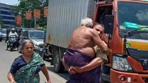 தந்தையை தோளில் தூக்கிச் செல்லும் மகன்