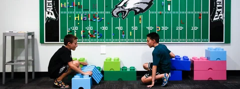 In this Thursday, Aug. 22, 2019, photo, 10-year-old twin brothers Ryan left, and Jack Ykoruk, play in the Lincoln Financial Field sensory room before a preseason NFL football game between the Philadelphia Eagles and the Baltimore Ravens in Philadelphia. (AP Photo/Matt Rourke)