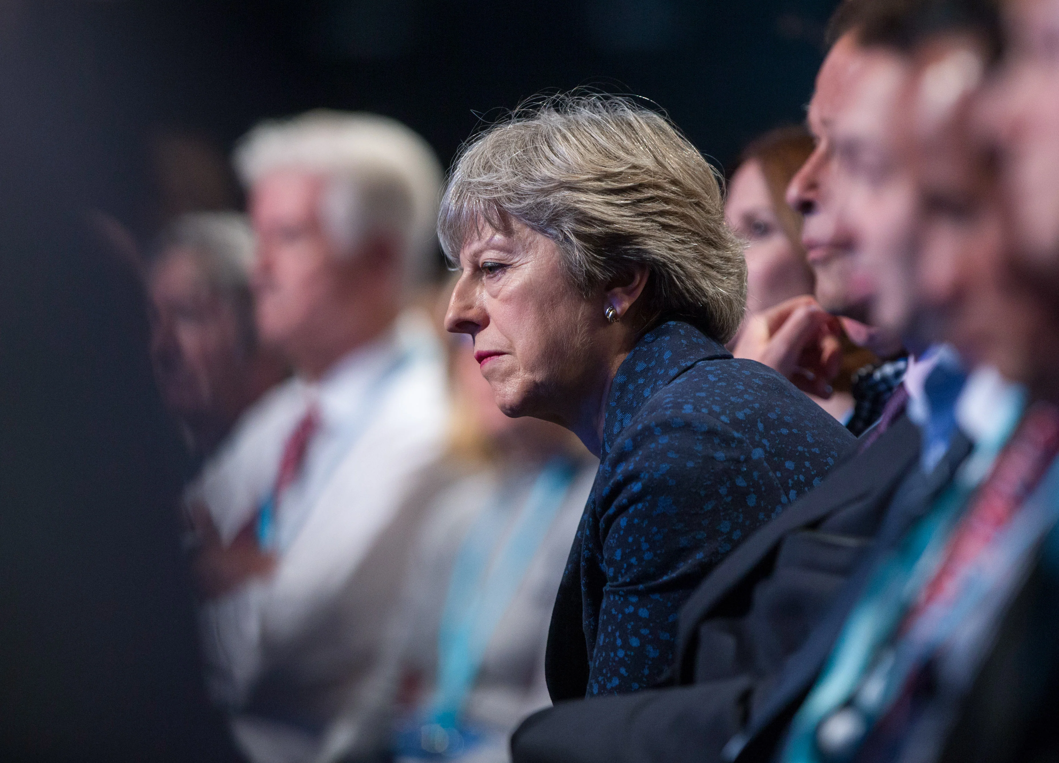 May Joins Trump, Macron in Dumping Davos Amid Problems at Home