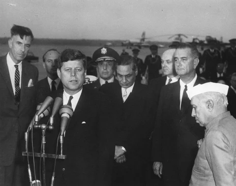 U.S. President John F. Kennedy speaks during the arrival ceremonies for Jawaharlal Nehru, Prime Minister of India, at Andrews Air Force Base, Maryland, on November 6, 1961. (Photograph: <a href="https://www.jfklibrary.org/Search.aspx?nav=Ntk:p_ContainerDigID%7cJFKWHP%2f-1961%2f-11%2f-06%2f-A%7c1%7c,Rpp:20,N:4294916916">White House Photographs</a>/JFK Library)