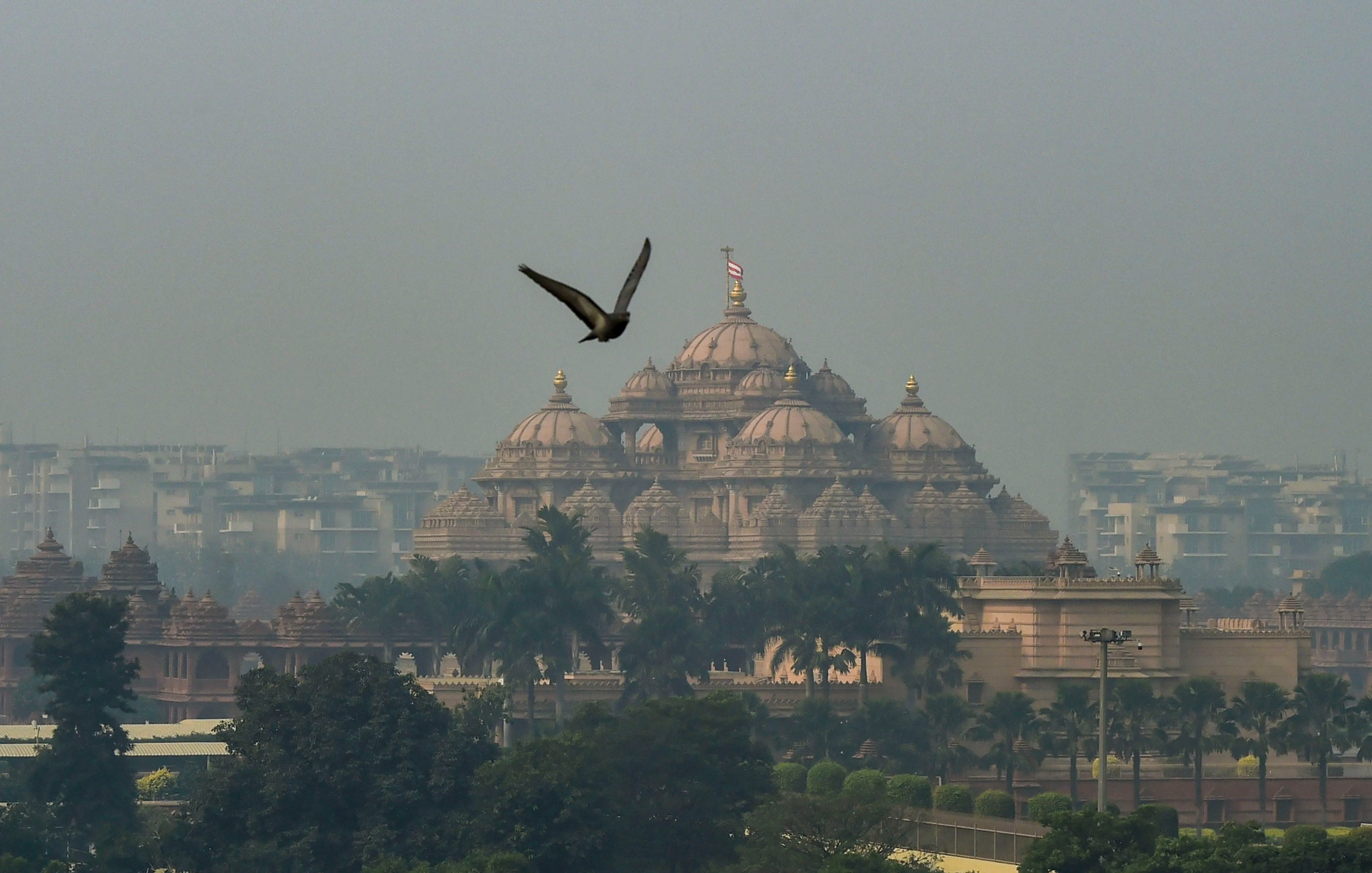A view of the Akshardham Temple shrouded in heavy haze post-Diwali celebrations, in New Delhi on Monday. (Photo: PTI)