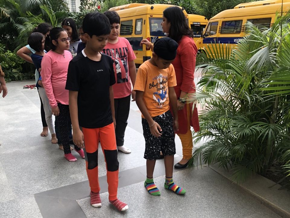 Young children and an Esha volunteer in a ‘Blind Walk’ session. (Photo: Esha)
