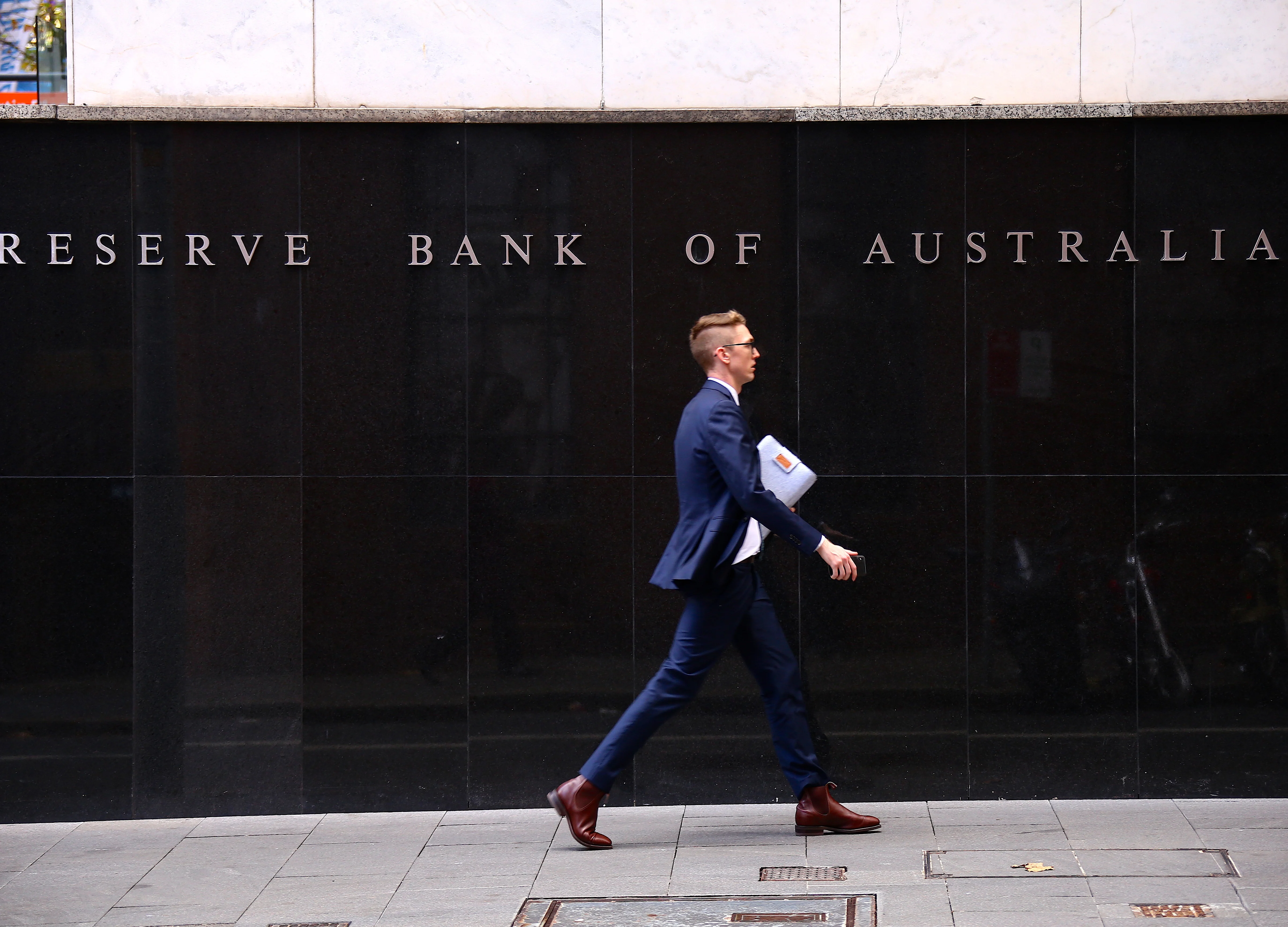 Australia Cuts Rates to Record-Low 0.75% as Global Risks Mount