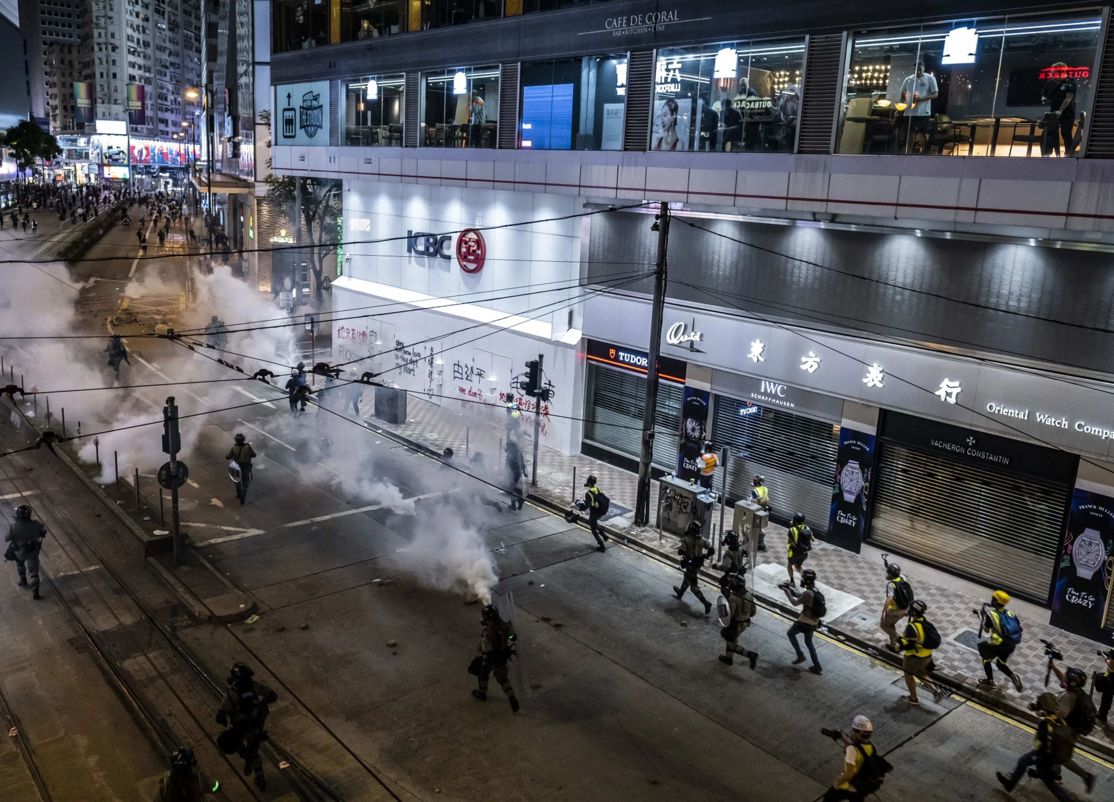 Hong Kong Violence Escalates With Bullets, Tear Gas, Man on Fire