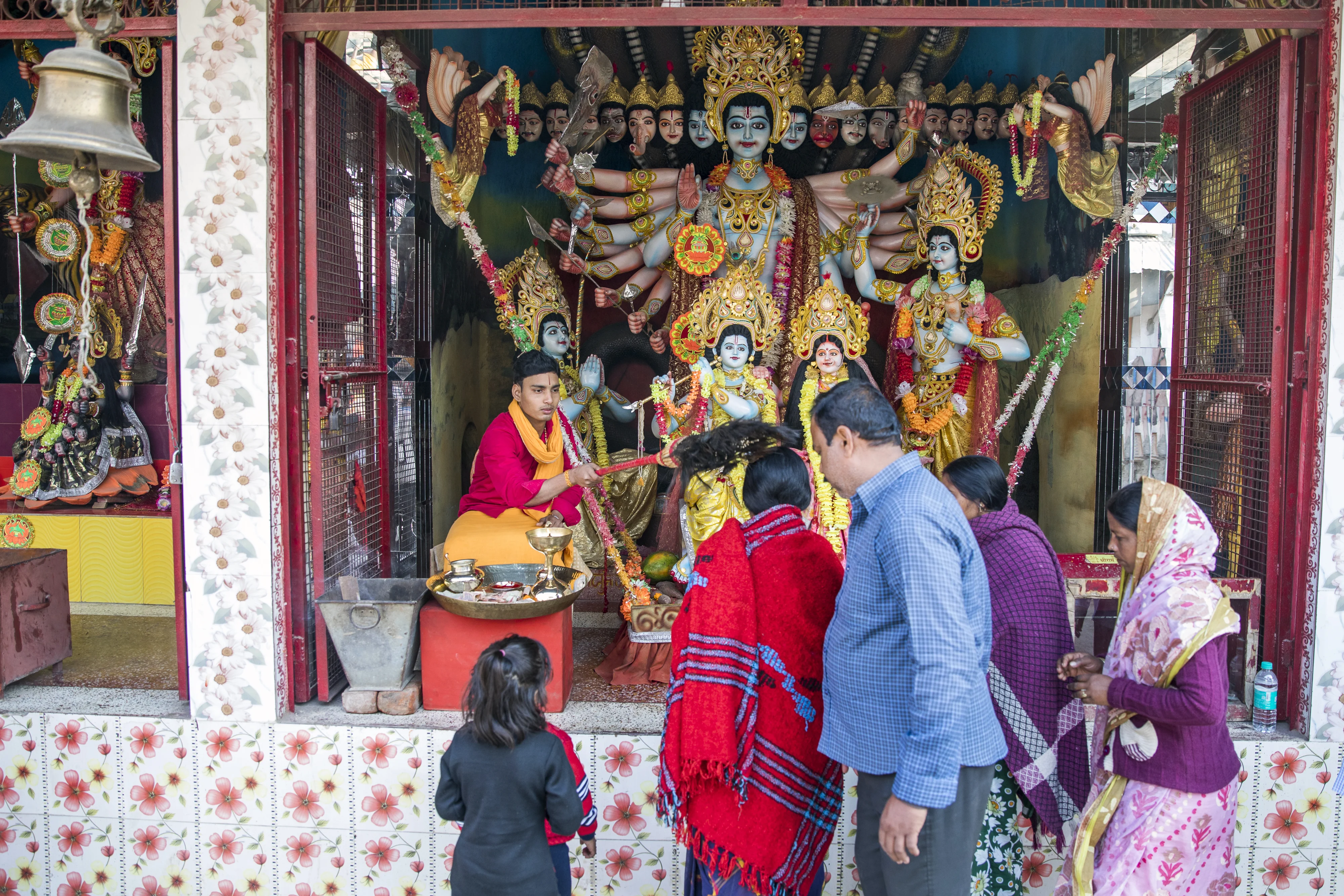 Pilgrims stand at a Hindu shrine in Ayodhya, Uttar Pradesh, India. (Photographer: Prashanth Vishwanathan/Bloomberg)