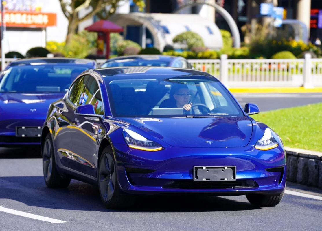 Tesla Flaunts First China-Built Cars as Start of Sales Nears