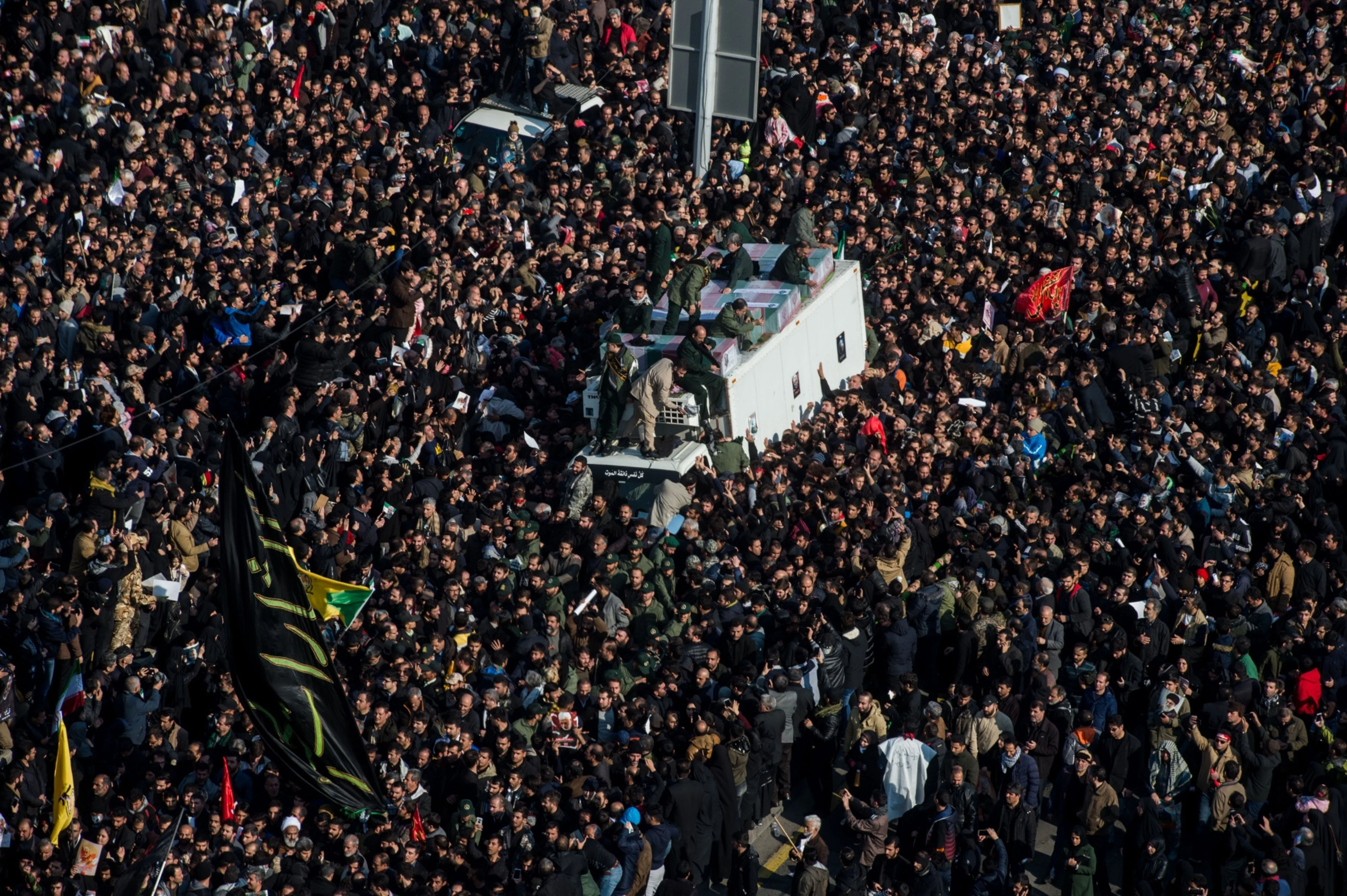 Mourners surround the coffins of Iranian General Qassem Soleimani and others killed in the U.S. airstrike during a funeral ceremony in Tehran, Iran. (Photographer: Ali Mohammadi/Bloomberg)
