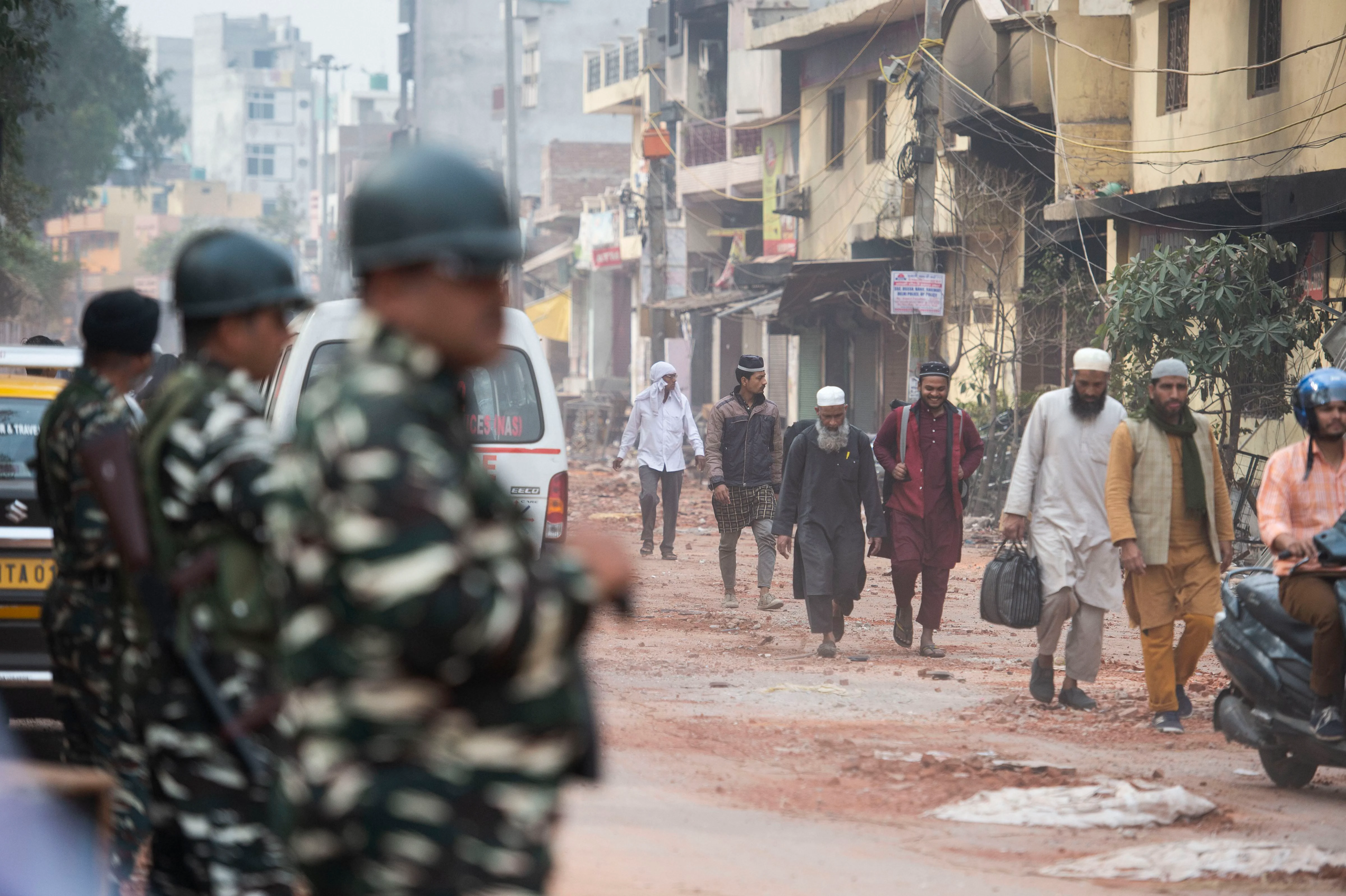 People leave their houses following the violence. (Source: PTI)