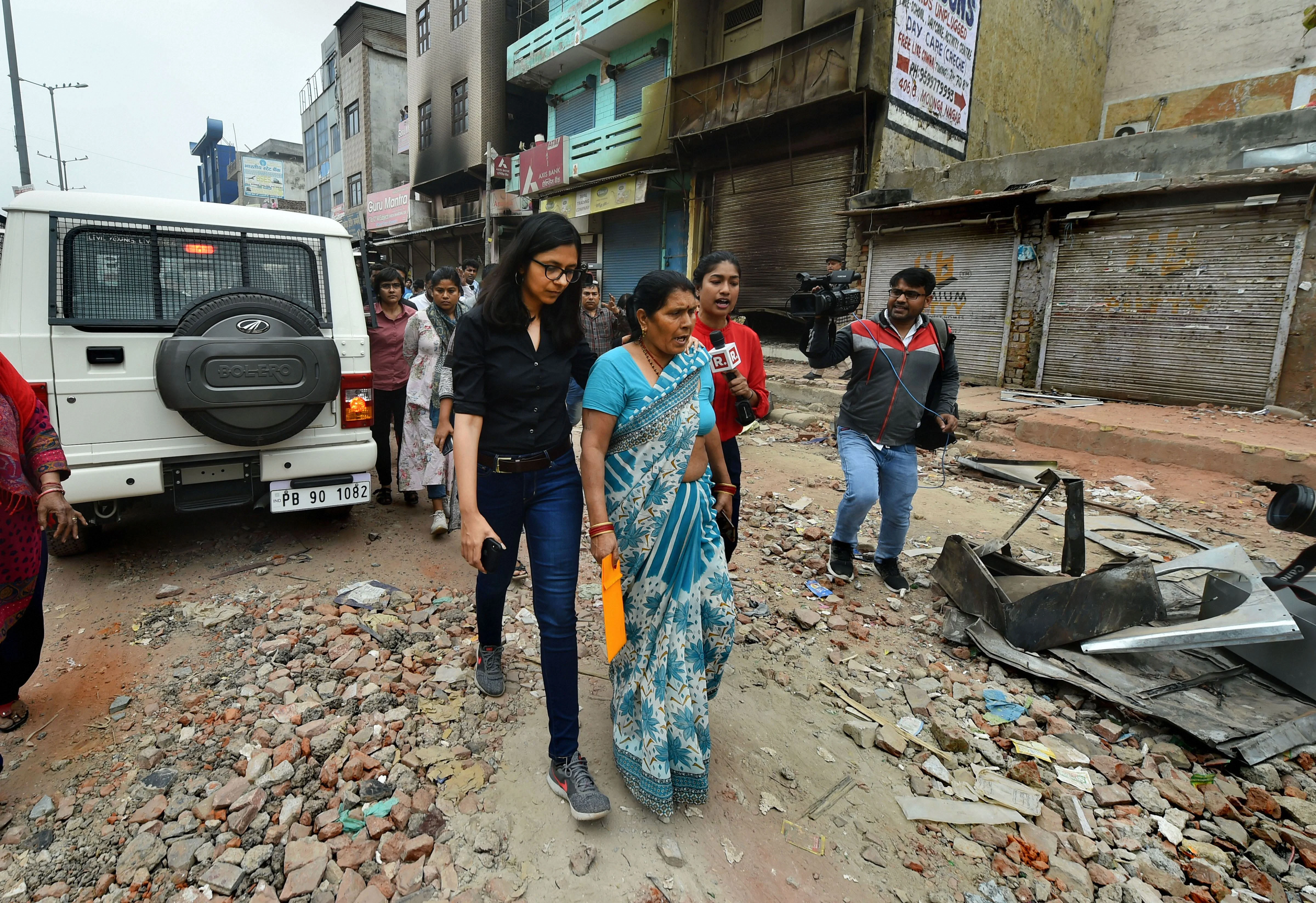 Delhi Commission for Women chief Swati Maliwal interacts with residents during her inspection at Khajuri Khas area of northeast Delhi on Thursday, Feb. 27, 2020. (Photo: PTI)