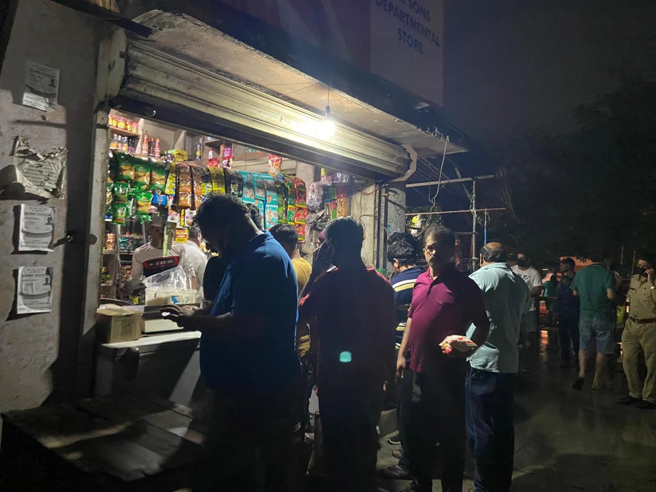 People gathered outside a store in Delhi. (Source: BloombergQuint)