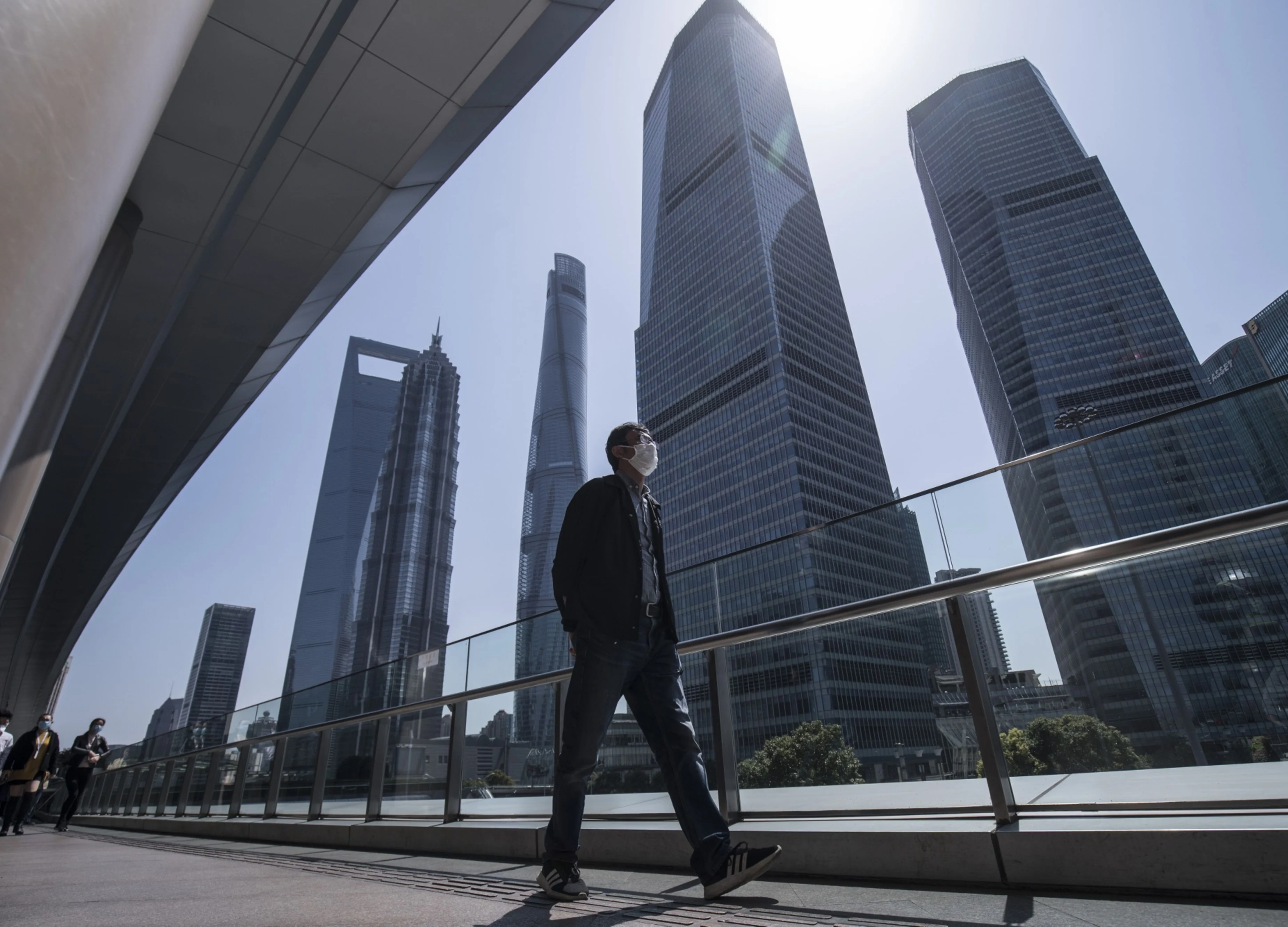As Wall Street Empties, Asia’s Bankers Slowly Head to Work