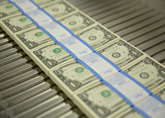 stacks of $1 dollar notes (photographer: andrew harrer/bloomberg
