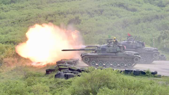 SAM YEH/AGENCE FRANCE-PRESSE
CM-11 tanks fire their cannons during a live-fire military exercise in Pingtung county, southern Taiwan.