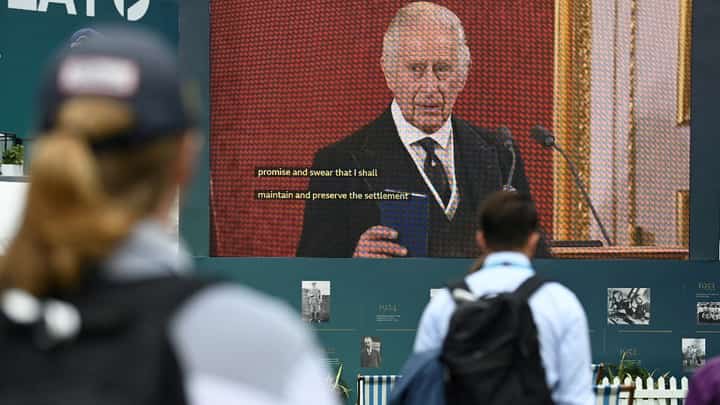Britain's King Charles III is seen on a giant screen as he speaks during a meeting of the Accession Council to proclaim his as the King, on day 2 of the BMW PGA Championship at Wentworth Golf Club, south-west of London, on September 10, 2022. - The European golf's PGA Championship resumes Saturday, after it was cancelled on Friday as a mark of respect following the death of Queen Elizabeth II on September 8. Photo by Glyn KIRK / AFP
