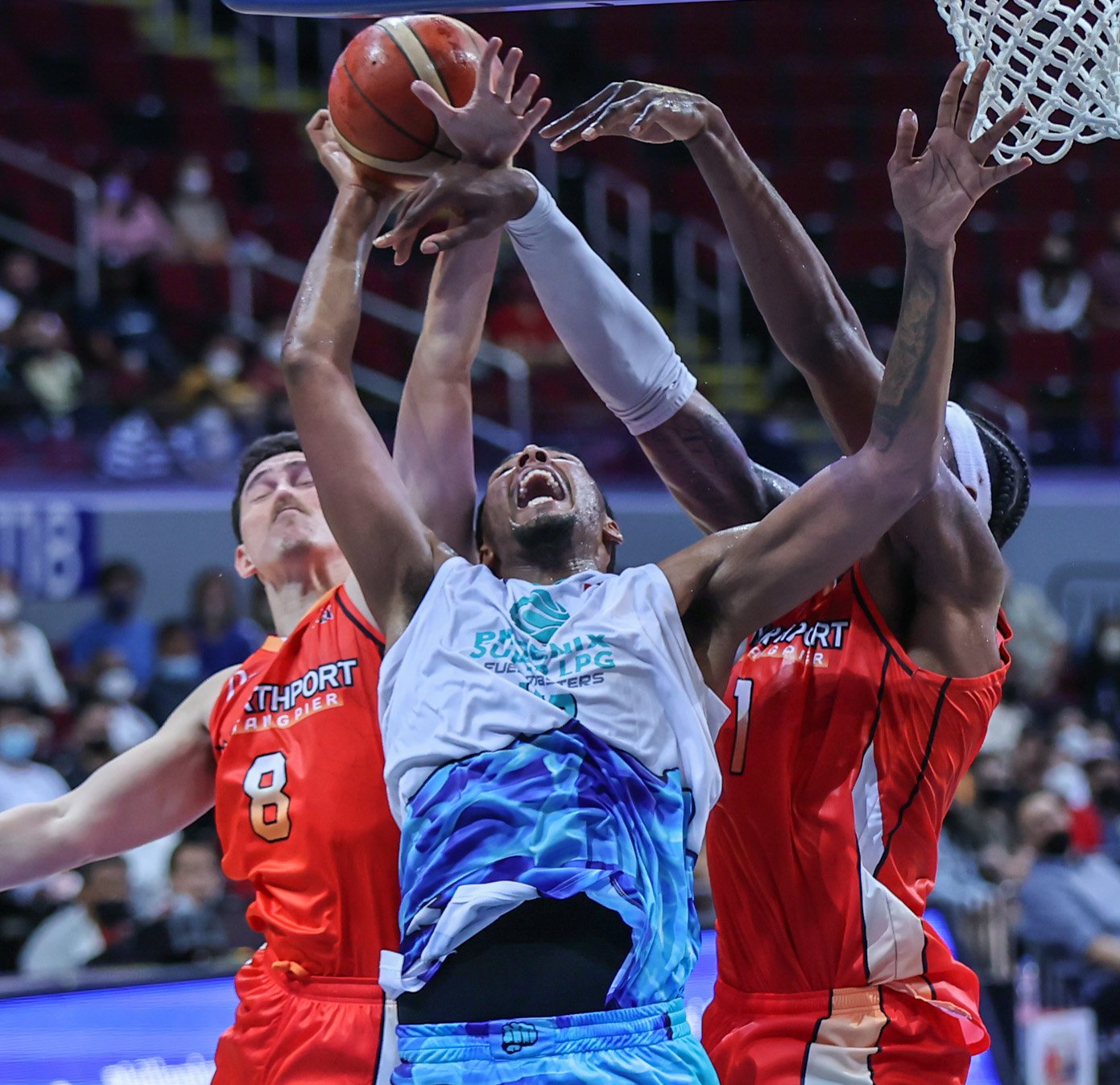 Northport's Robert Bolick (left) and Prince Ibeh stop Phoenix's Kaleb Wesson from scoring during the PBA Commissioner's Cup at the Mall of Asia Arena in Pasay, September 21, 2022. Photo by Rio Deluvio