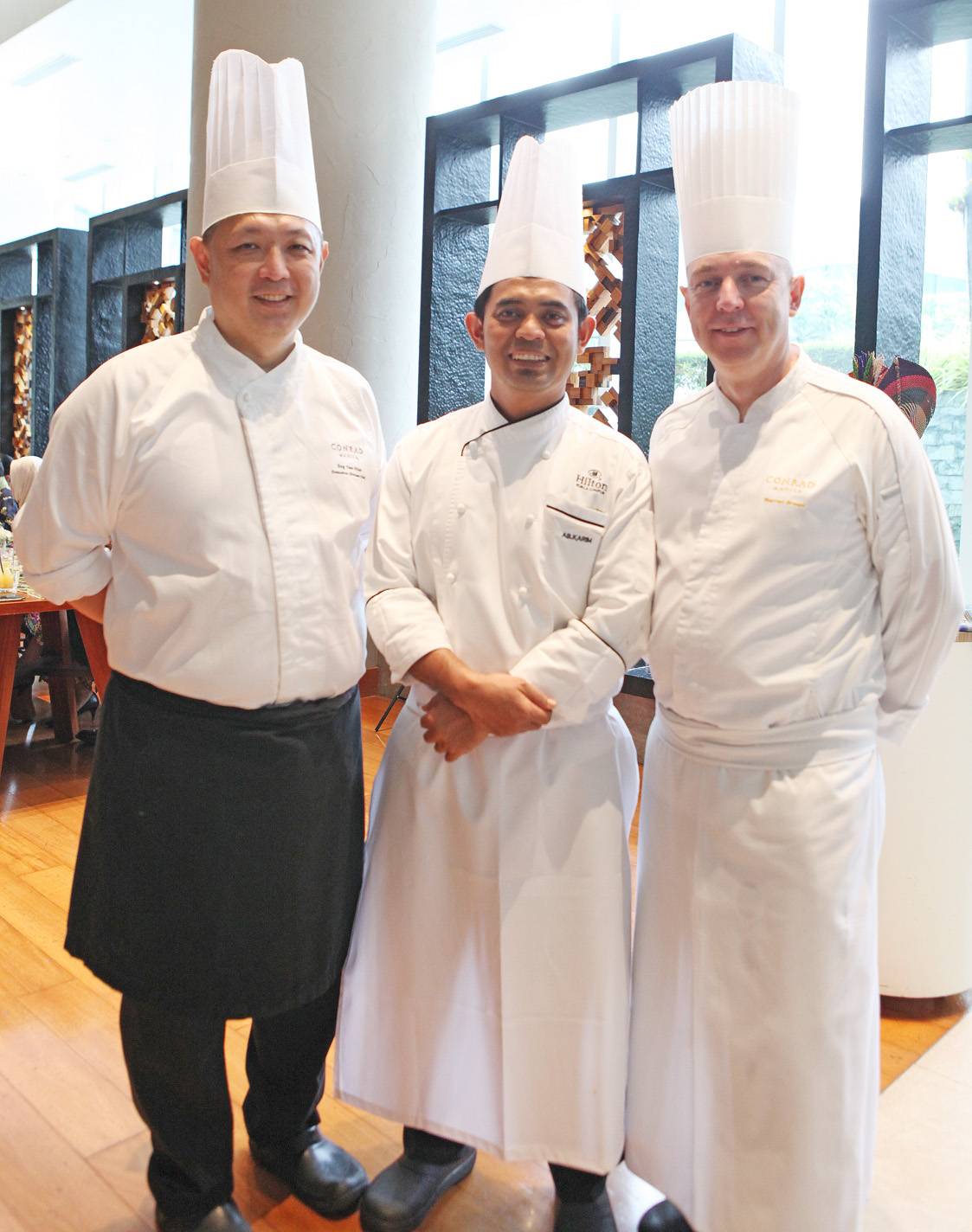 (from left): China Blue by Jereme Leung executive chef Eng Yew Khor; visiting Malaysian chef Karim from Hilron KL; and Conrad Manila executive chef Warren Brown.