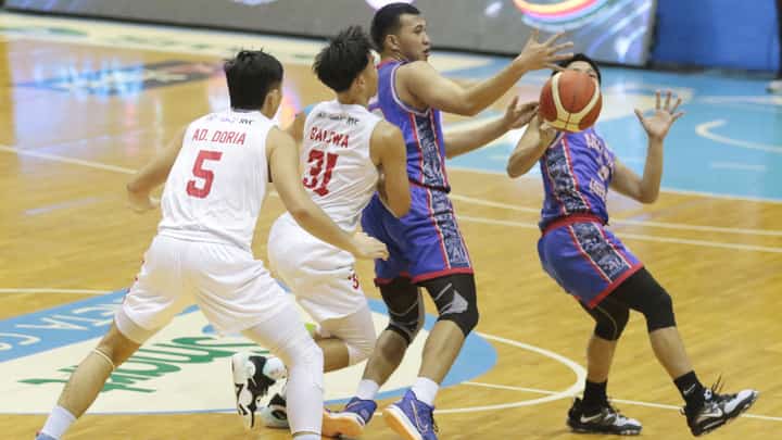 Adam Doria and Adrian Balowa of Emlio Aguinaldo College and Darrel Shane Menina and Wilmar Oftana of Arellano battle for the loose ball during the opening game of Season 98 National Collegiate Athletic Association at the Smart Araneta Coliseum. | Photograph by Joey Sanchez Mendoza for the daily tribune @tribunephl_joey