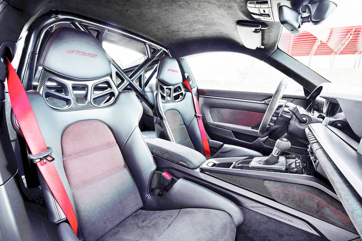 INSIDE, this new GT sports car is finished in typical RS style: Black leather, Racetex and carbon-weave finish characterize the purist, sporting ambience.