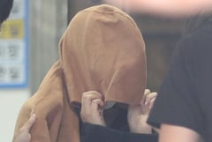 ‘Mom’ of dead children in suitcases arrested