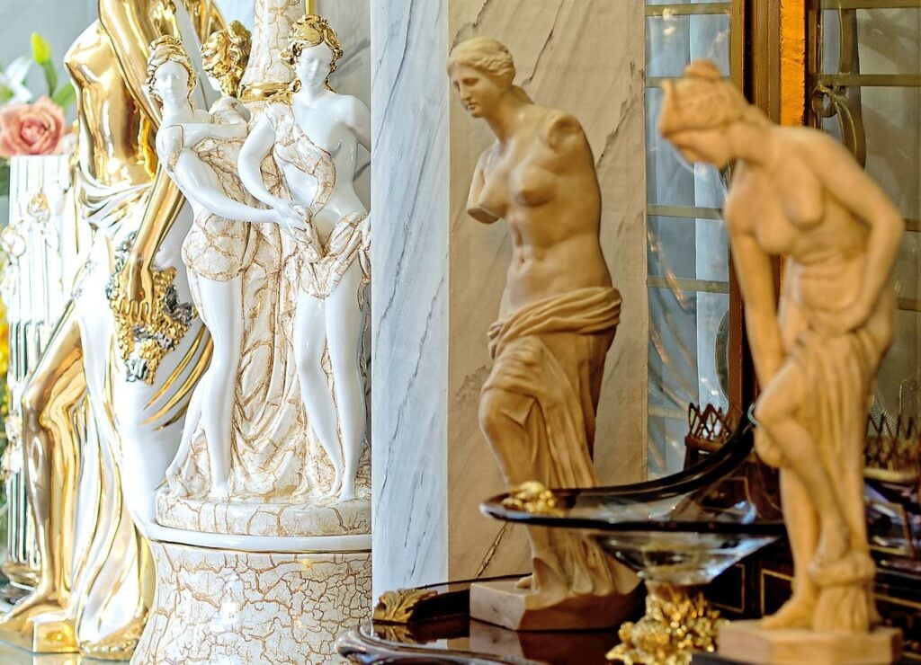 Statues of Greek goddesses are at home in this resplendent setting.