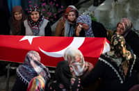 Women react in front of the coffin during a funeral ceremony for Ridvan Acet, one of the miners who died after an explosion in a coal mine in Amasra, in Turkey's Bartin Province, on October 15, 2022. - Rescuers on October 15, 2022 searched for the last miner missing at a coal mine in northern Turkey, where a methane blast the previous day killed at least 40 people in one of the country's worst industrial accidents in years. Photo by Yasin AKGUL / AFP