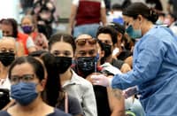 In this file photo, a man receives a booster dose of the AstraZeneca COVID-19 vaccine at a vaccination center for people over 18 years old, in Guadalajara, Jalisco state, Mexico, on 6 April 2022. (Photo by ULISES RUIZ / AFP)