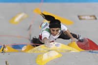 Iranian greeted as hero after competing without hijab