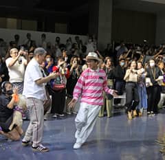 BENCH founder Ben Chan (left) applauds designer Lesley Mobo after the latter's Masaganang Bukid fashion presentation.