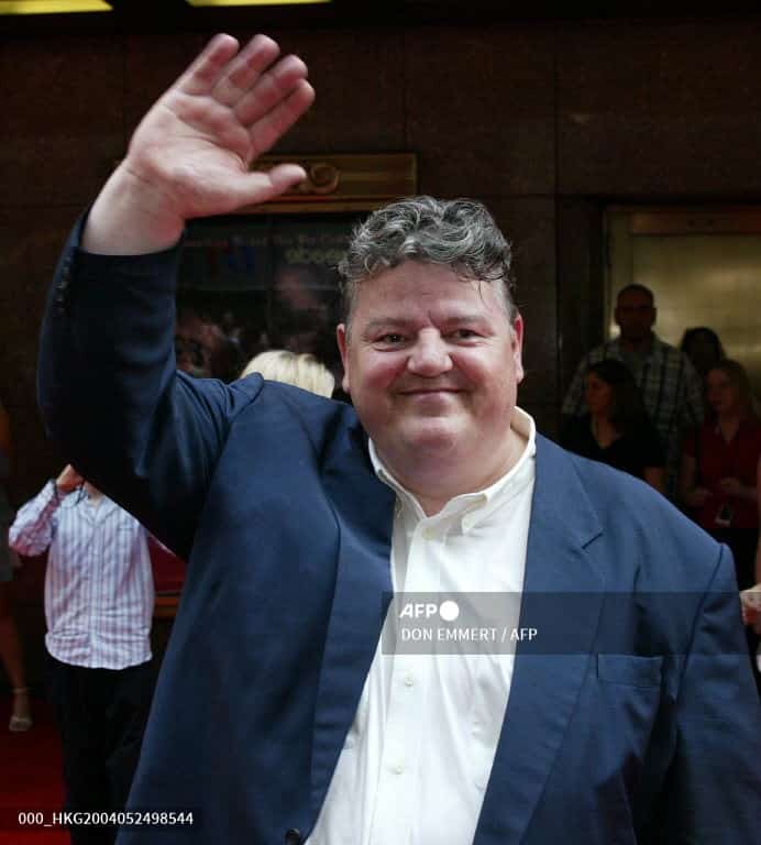 In this file photo, Robbie Coltrane, who played Rubeus Hagrid in the Harry Potter movie series, waves to the crowd before the premiere of "Harry Potter: Prisoner of Azkaban" at Radio City Music Hall in New York on 23 May 2004. (Photo by AFP) PHOTO/Don EMMERT (Photo by DON EMMERT / AFP)