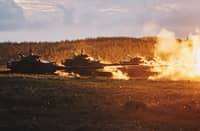 This Taiwan Ministry of National Defense handout picture taken and released on 24 August 2022 shows US-made M60-A3 tanks firing during a drill at Penghu islands. (Photo by Handout / Taiwan's Ministry of National Defense / AFP)