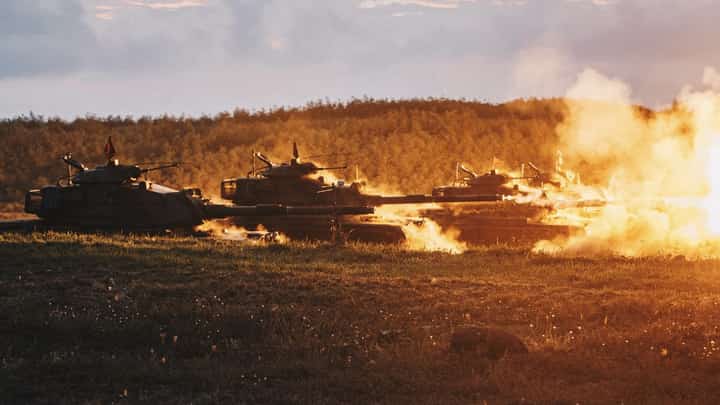 This Taiwan Ministry of National Defense handout picture taken and released on 24 August 2022 shows US-made M60-A3 tanks firing during a drill at Penghu islands. (Photo by Handout / Taiwan's Ministry of National Defense / AFP)
