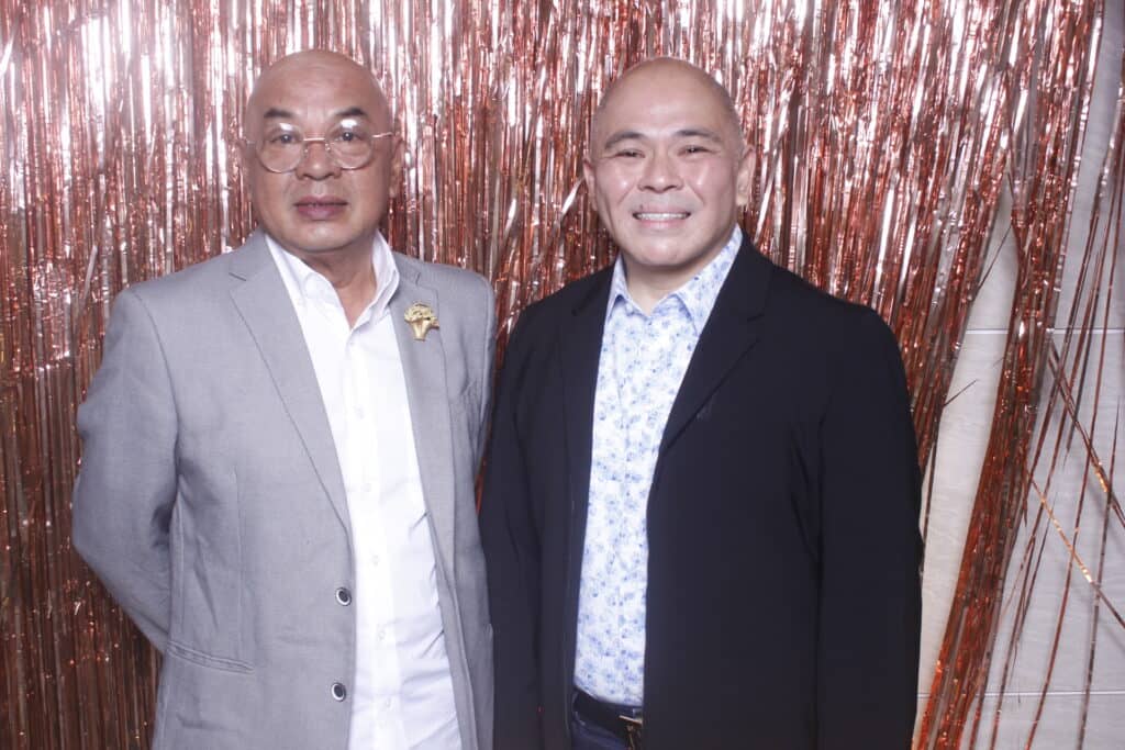 The columnist with Noel Sy.