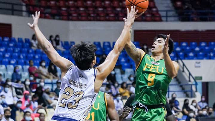 Bryan Sajonia of Far Eastern University skies for a layup against Mike Malonzo of National University in their UAAP Season 85 men's basketball encounter at the Ynares Sports Center in Antipolo on Sunday.