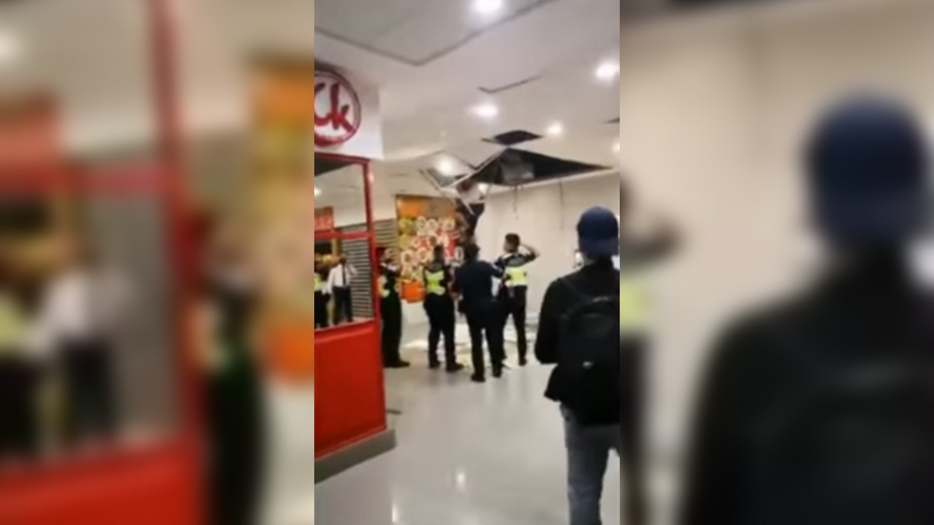 VIDEO grab of the airport police pulling down from the ceiling Agustin Diva. | IMAGE COURTESY OF MIAA