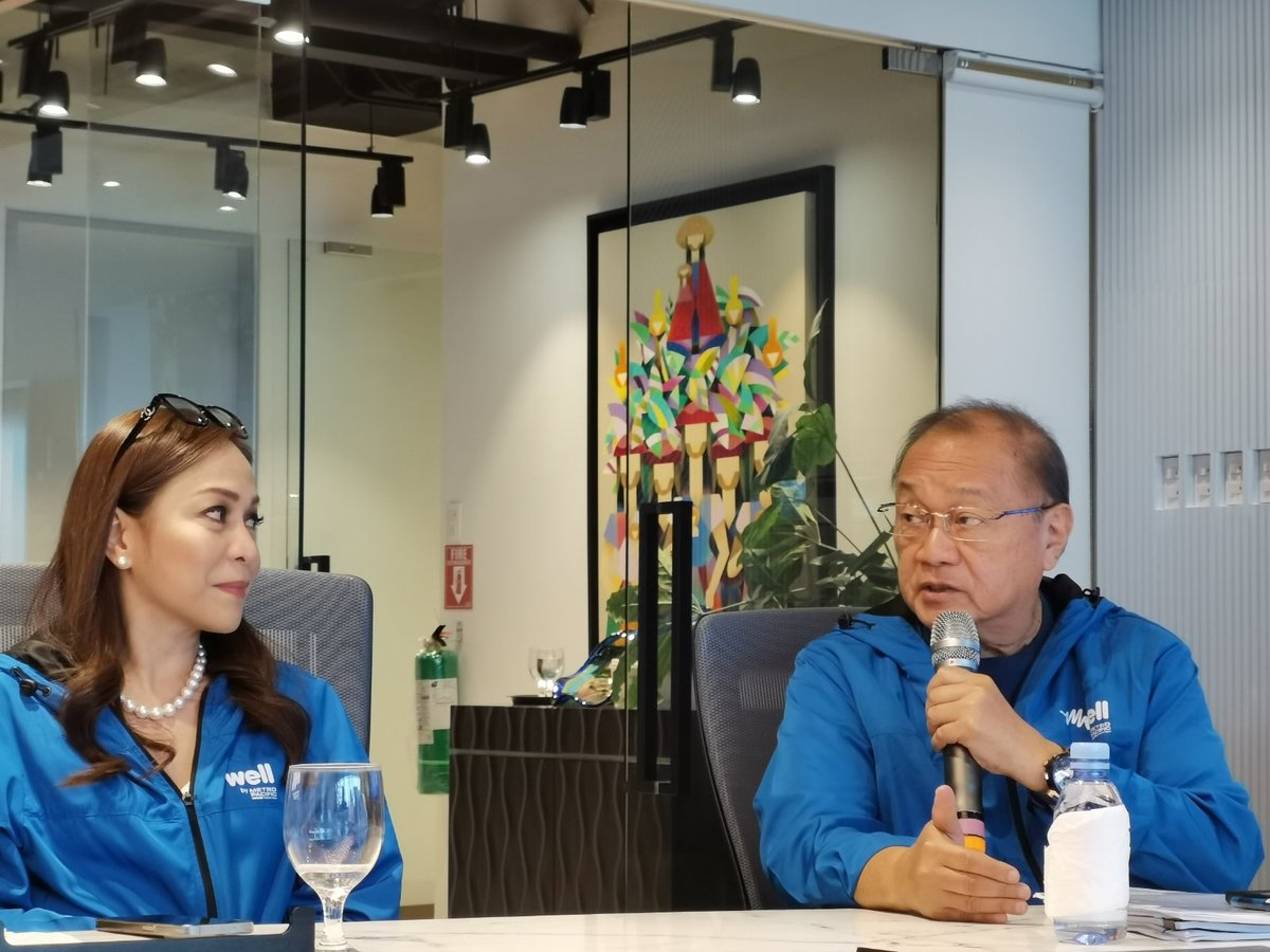 Metro Pacific Investment Corp. chief finance, risk and sustainability officer Chaye Cabal-Revilla and president, chairman and CEO Manny V. Pangilinan