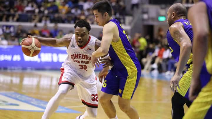 Barangay Ginebra import Justin Brownlee tries to extricate from the defense of the tight-guarding Roger Pogoy of TNT.